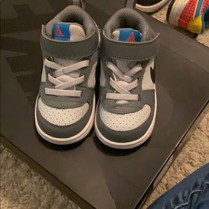 Gray and Black toddler Nike’s